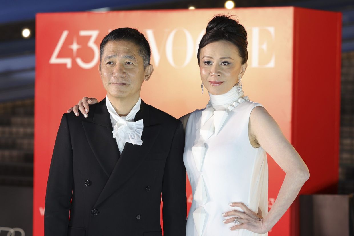 Tony Leung Chiu-wai (left) and Carina Lau attend the 43rd Hong Kong film awards. Photo: AP