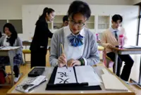 Foreign tourists get taught the Japanese high school experience