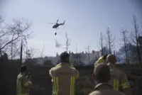 Israel firefighters battle bushfires near Jerusalem for second day as roads reopen