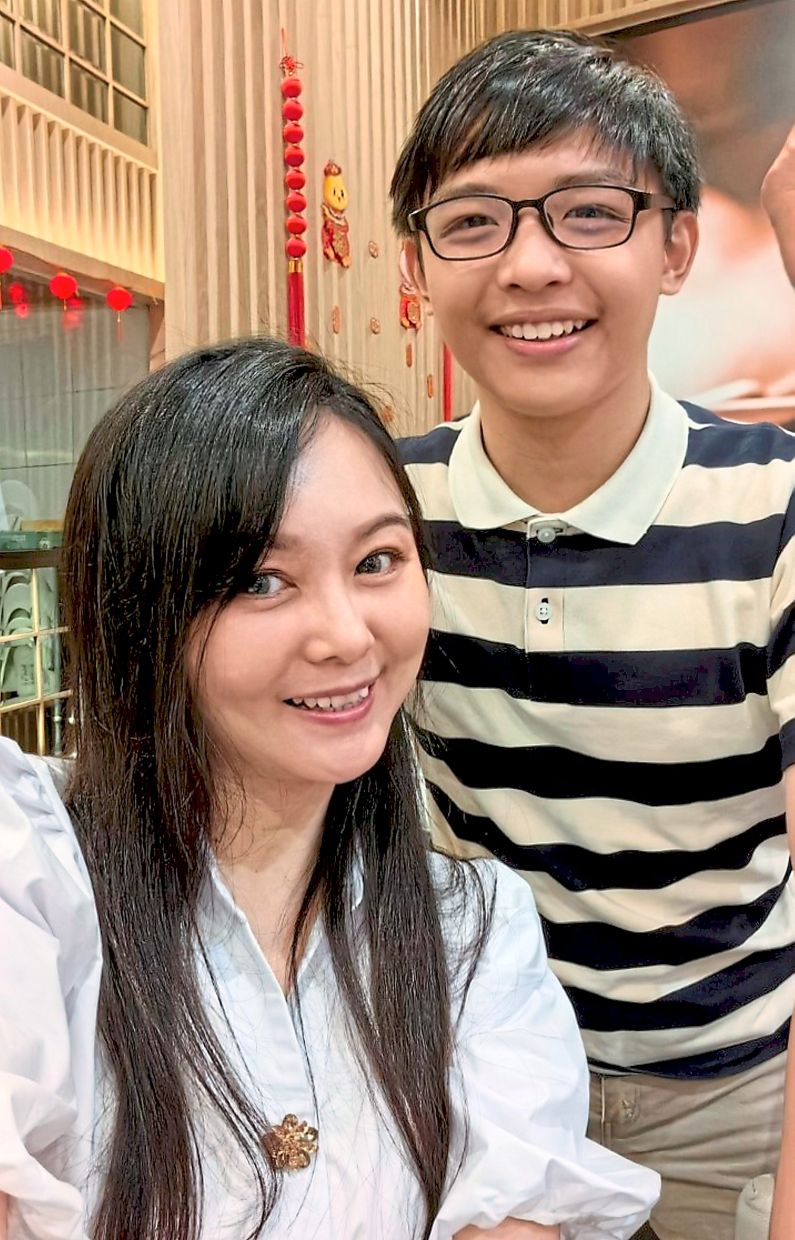 Lead by example: Mak, with Lex, says she wanted to experience what her students were experiencing when taking the exam so she could better prepare them.