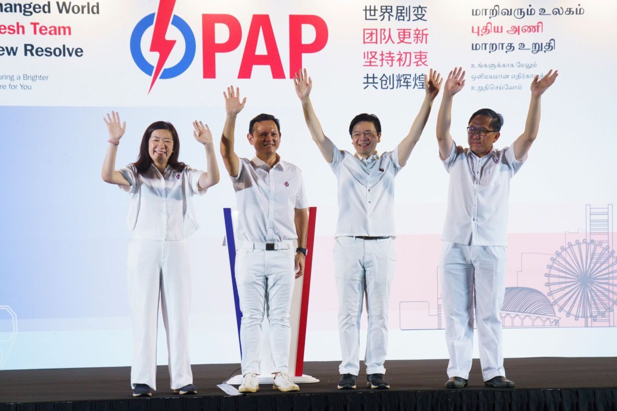 Lawrence Wong, Singapore's prime minister and secretary general of the People's Action Party (PAP), second right, waves to the crowd at an election night event in Singapore, early on Sunday, May 4, 2025. Singapore's ruling party was on track to secure a convincing victory in Saturday's election as voters worried about rising costs and a worsening global economic climate rallied behind incumbent Wong in his first electoral test since taking office a year ago. -- Photographer: Ore Huiying/Bloomberg
