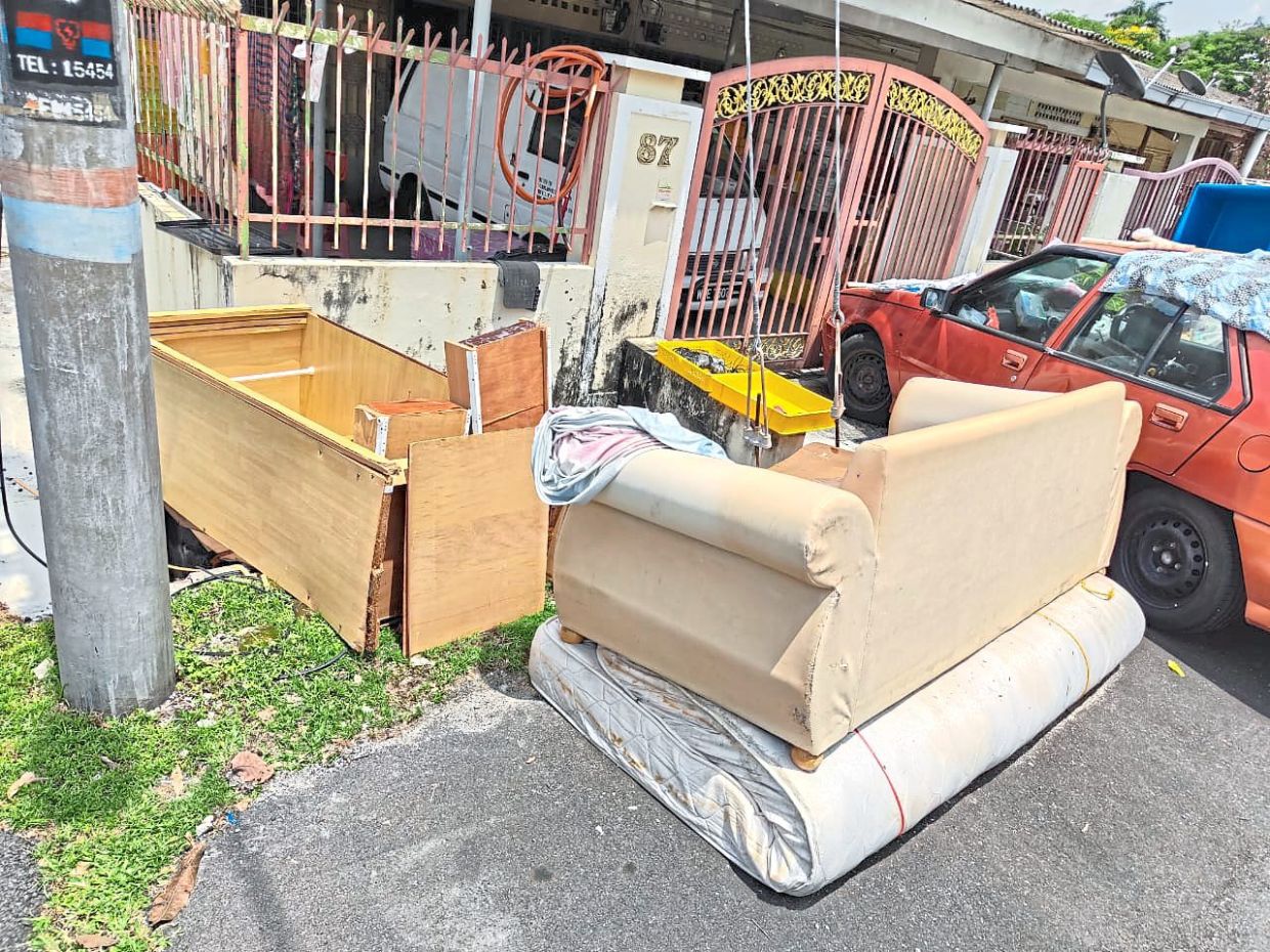 Many residents in Taman Antoi in Kepong, Kuala Lumpur had to dispose of their damaged furniture following the flood in August last year. — Courtesy photo