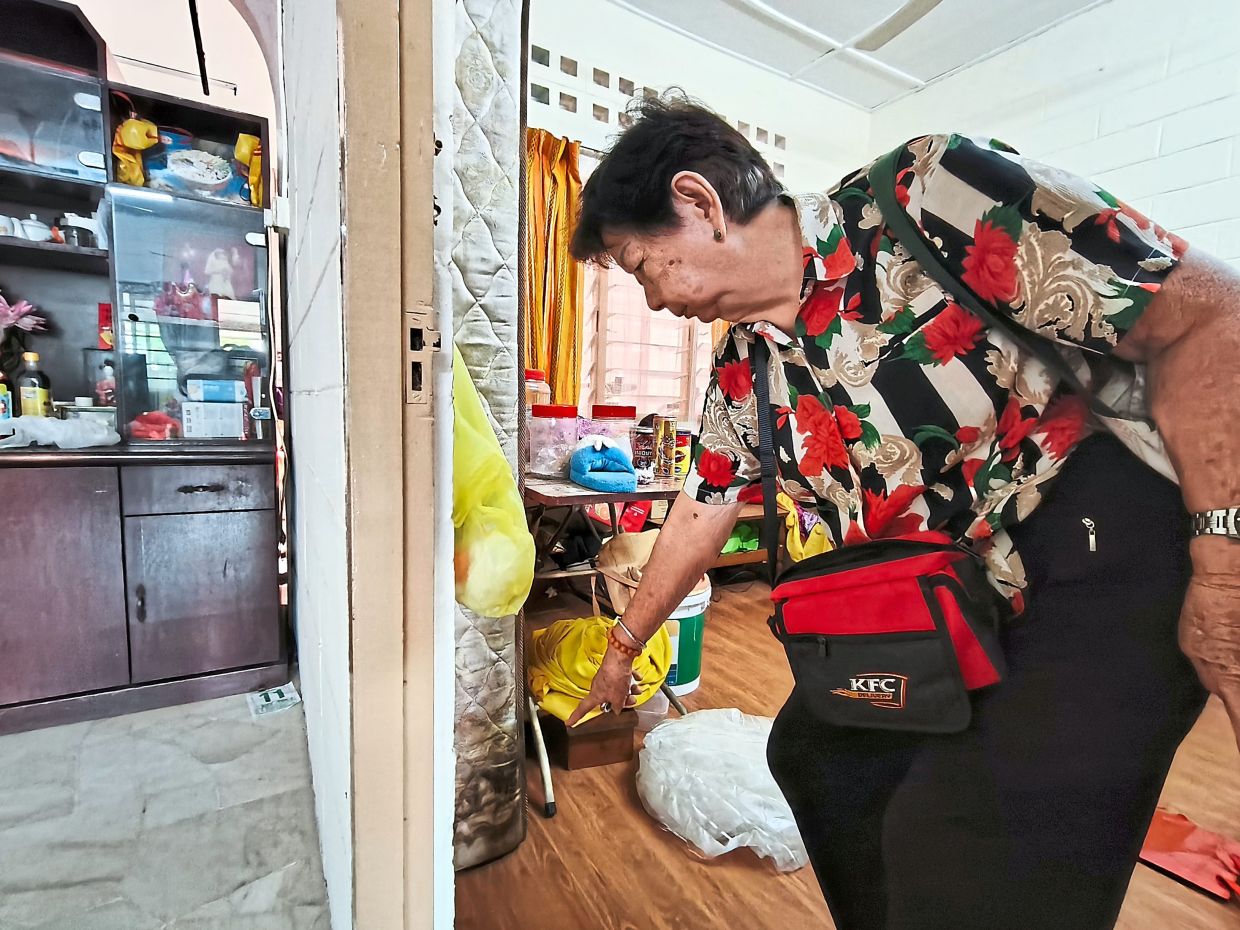 Lee has been unable to replace the mattress that was damaged when her home in Taman Antoi was hit by floods last August.