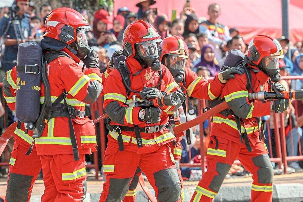 Always doing their best: Members of the Malaysian Fire and Rescue Department performing a fitness demonstration during the World Firefighters Day 2025 celebration. — Bernama
