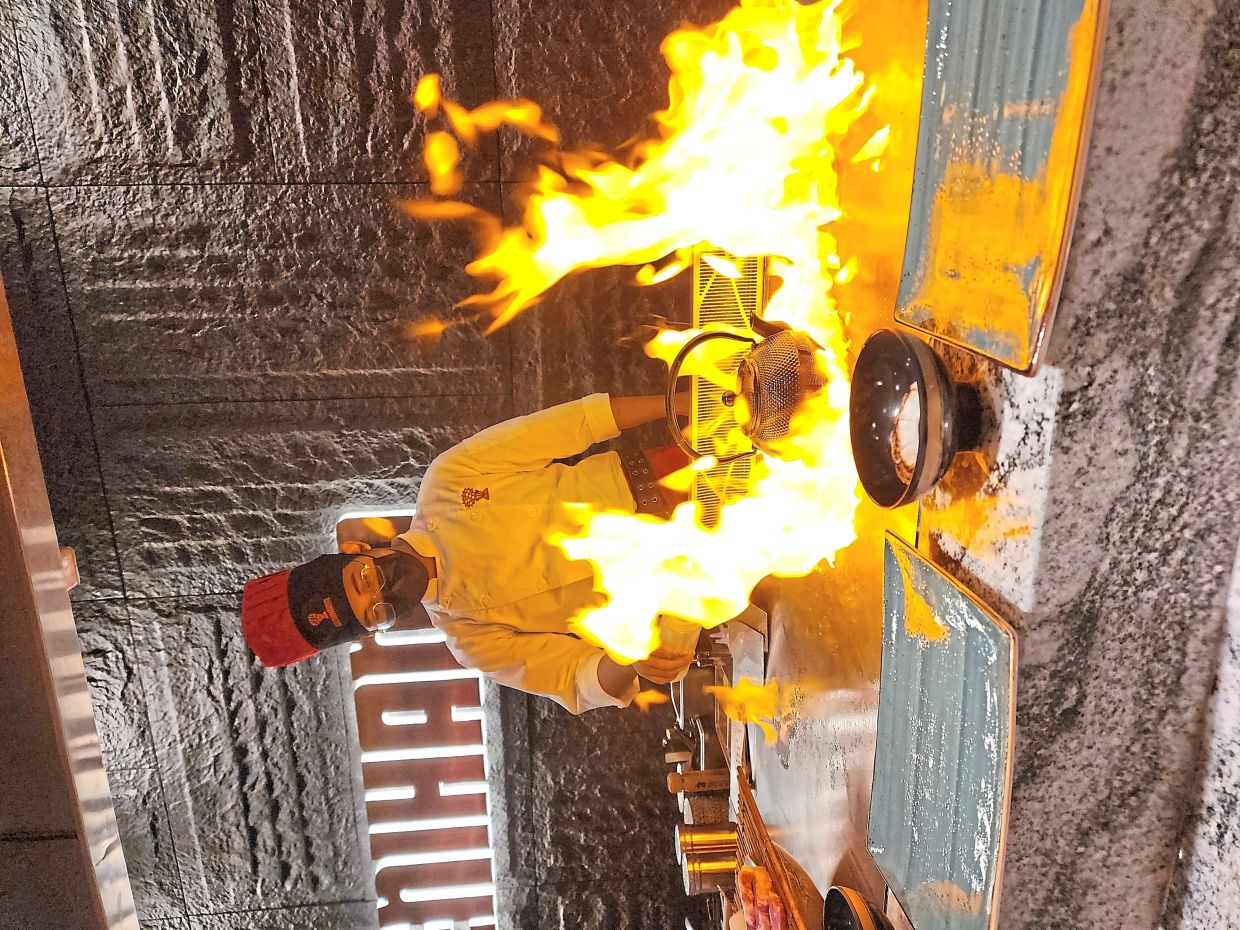 The culinary theatre on display features an exciting fire show that is sure to mesmerise diners. — ABIRAMI DURAI/The Star 