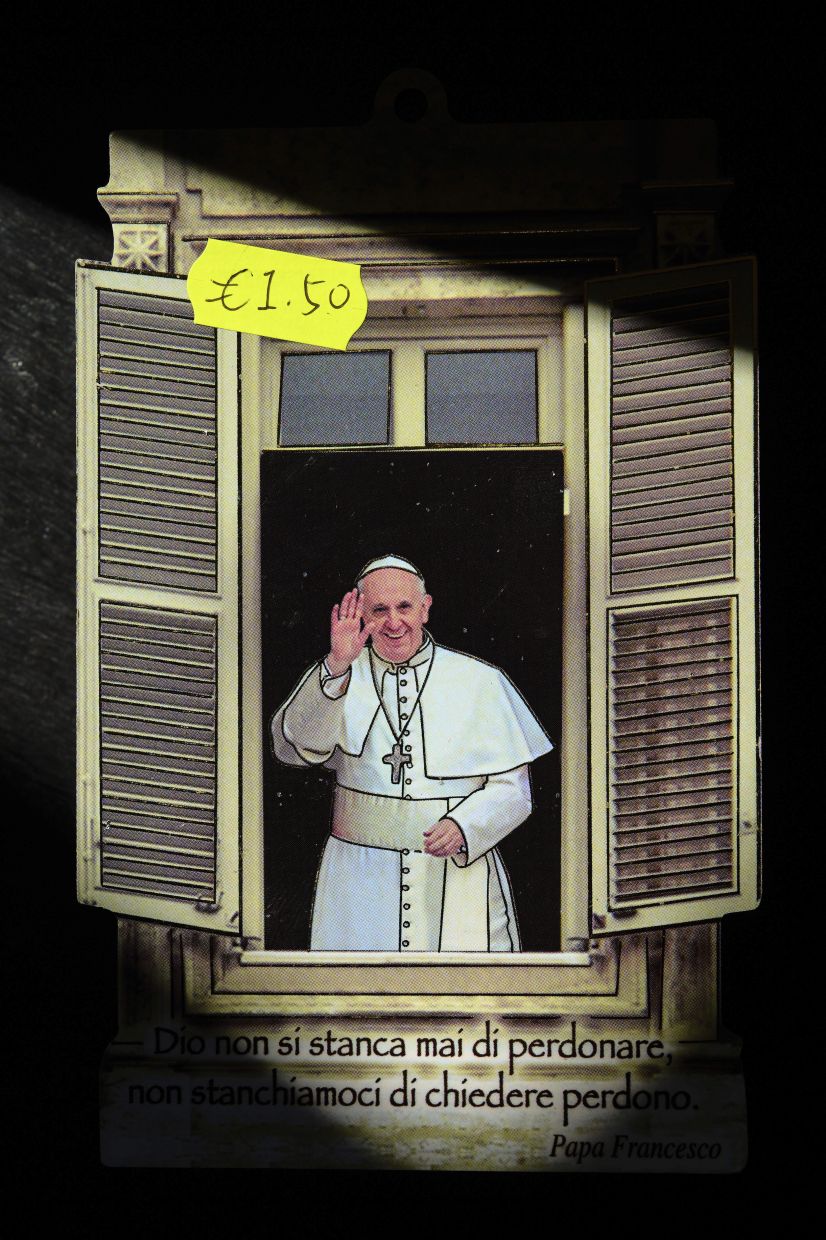 A card featuring an artwork of the late Pope Francis being sold as a souvenir. 