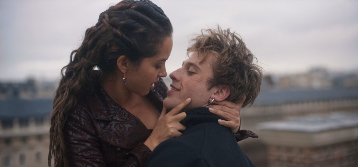 This image released by Apple TV+ shows Lyna Khoudri, left, and Benjamin Voisin in a scene from 'Careme'.