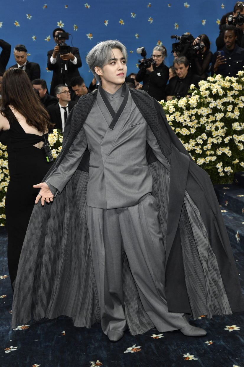 S.Coups' classic gray suit from BOSS was inspired by the traditional Korean hanbok. The suit was custom-made to preserve the details of the hanbok’s collar and skirt. - AP