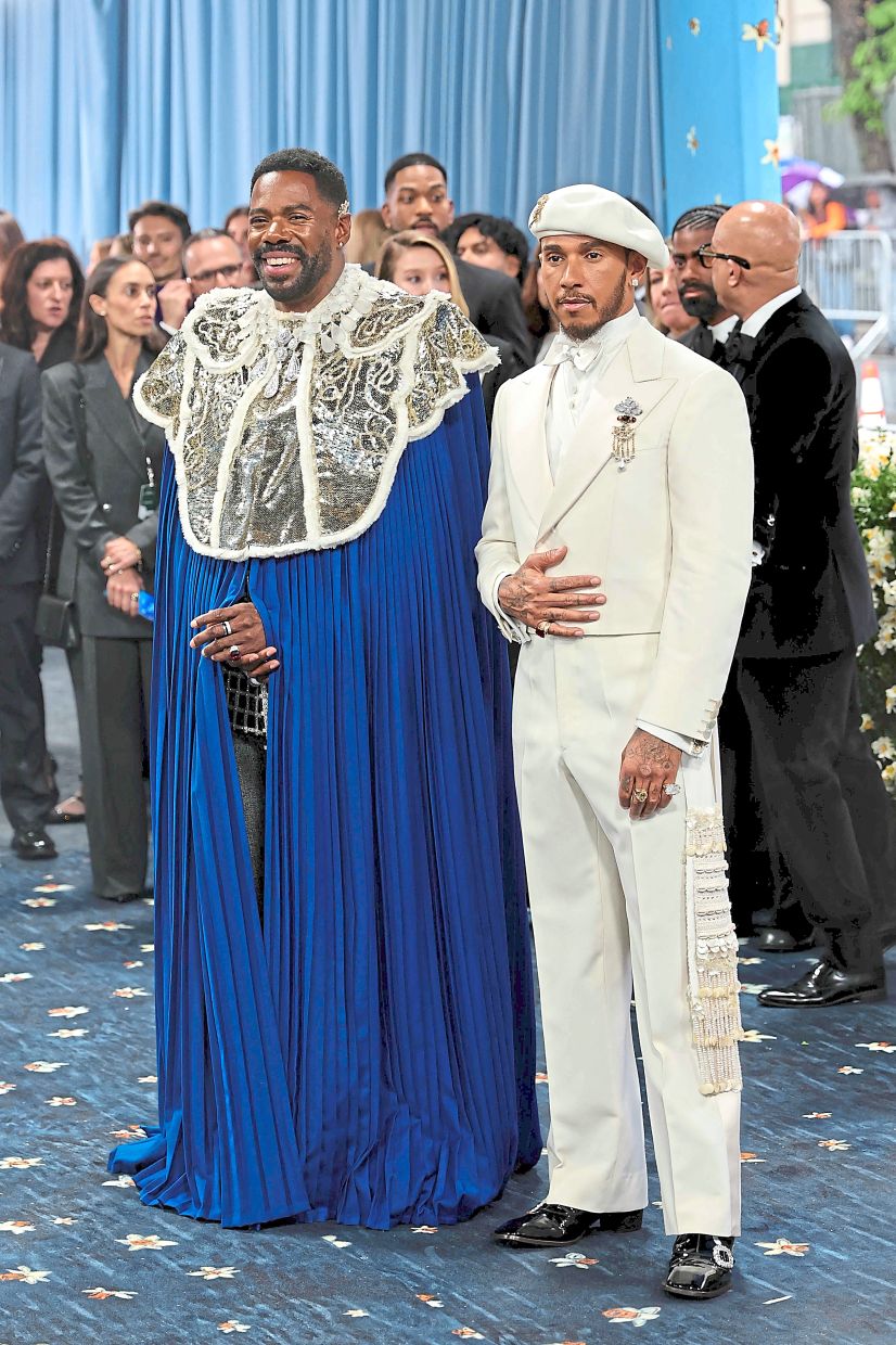 Met Gala Co-Chairs, actor Colman Domingo (left) wore a pleated Valentino cape while Formula 1 driver Lewis Hamilton went for a custom suit and a matching beret by Grace Wales Bonner. — AFP