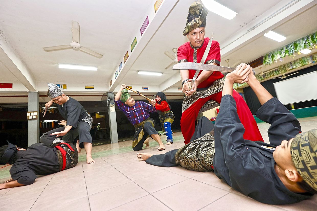 Silat practitioners in traditional attire during training at SK Taman Segar in Kuala Lumpur. — FAIHAN GHANI/The Star