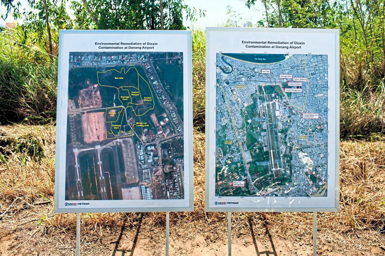 Reaching far and wide: Maps of the areas contaminated with dioxin around Danang airport are displayed during a ceremony marking the start of a project to clean up the toxin on Aug 9, 2012. — AP