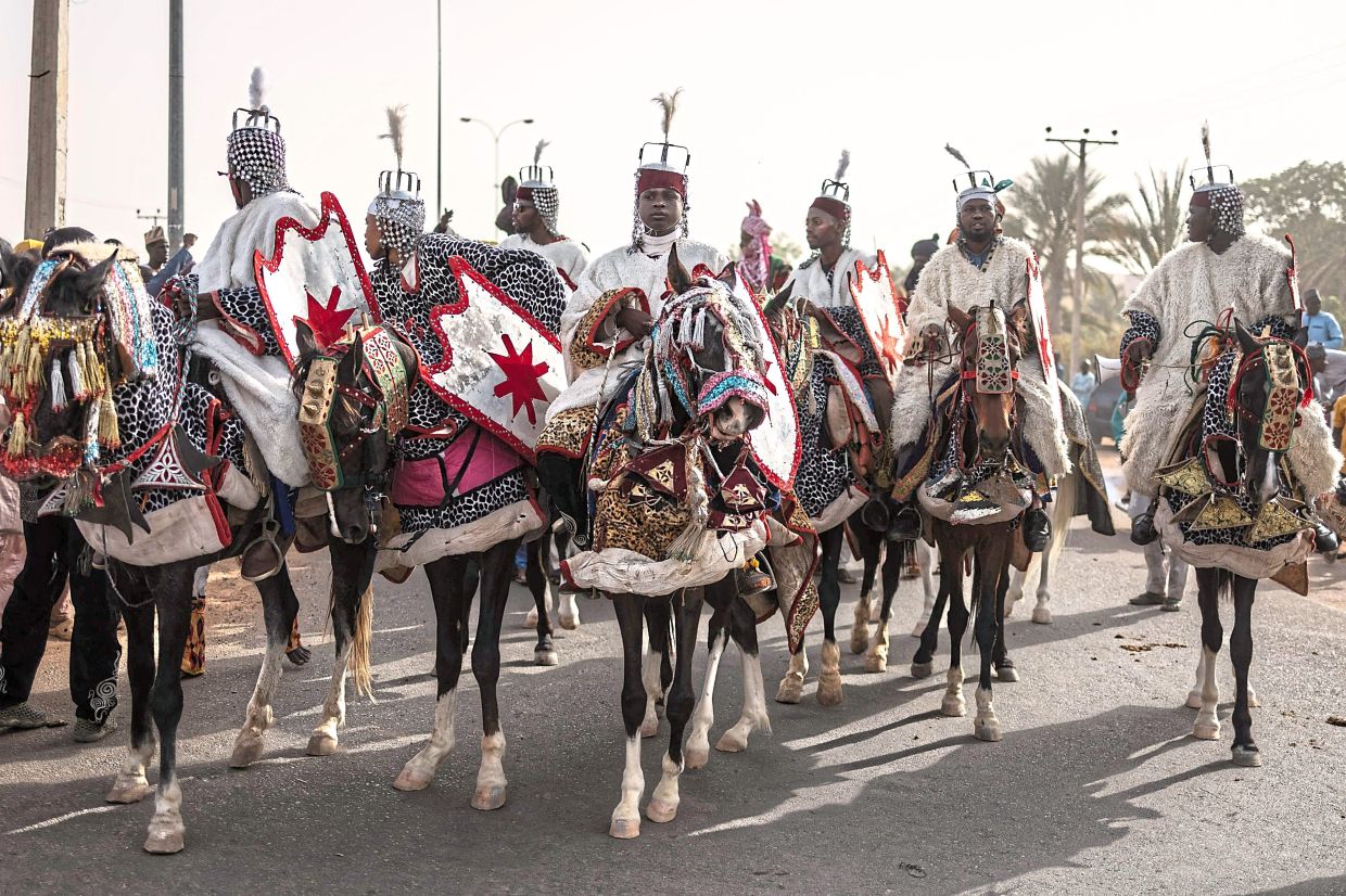 Horsemen parading during the Durbar horse procession.-AFP