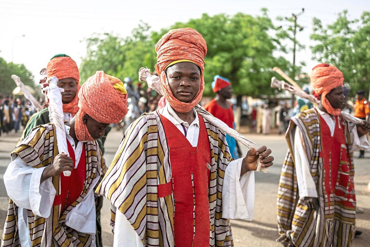 Members of a royal troupe parading during the Durbar horse procession. — AFP