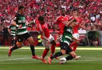 Soccer-Sporting made to wait for title after Benfica earn derby draw
