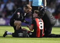 Soccer-Bournemouth's Scott to undergo surgery after breaking jaw during Villa loss