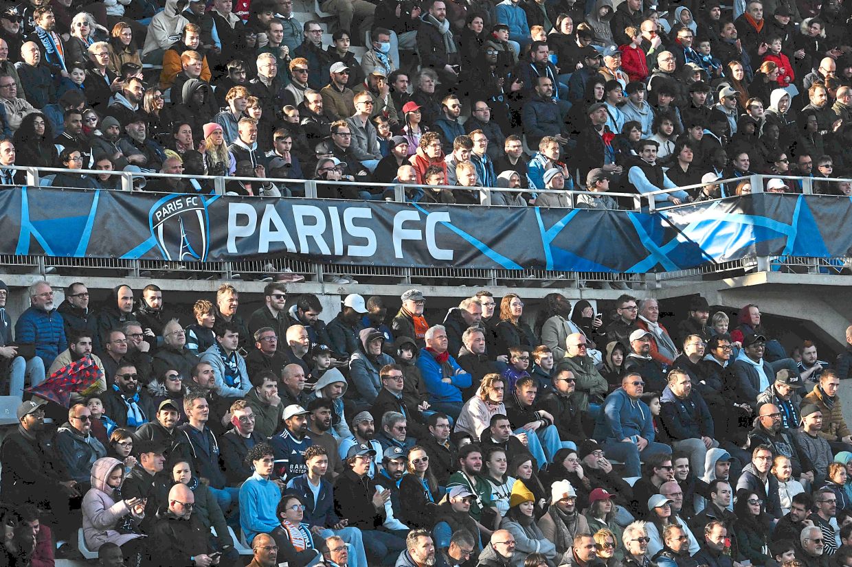 Paris FC supporters during the match against Lorient on March 8. — AFP