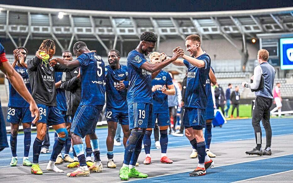 Paris FC’s Mohamed Toure and Jules Gaudin celebrate after the French Ligue 2 match against Grenoble.
