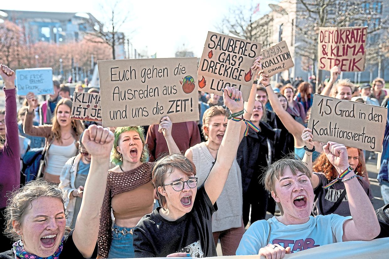 Participants chant slogans during a climate strike demonstration organised by the international movement Fridays for Future. Photo: EBRAHIM NOROOZI/AP