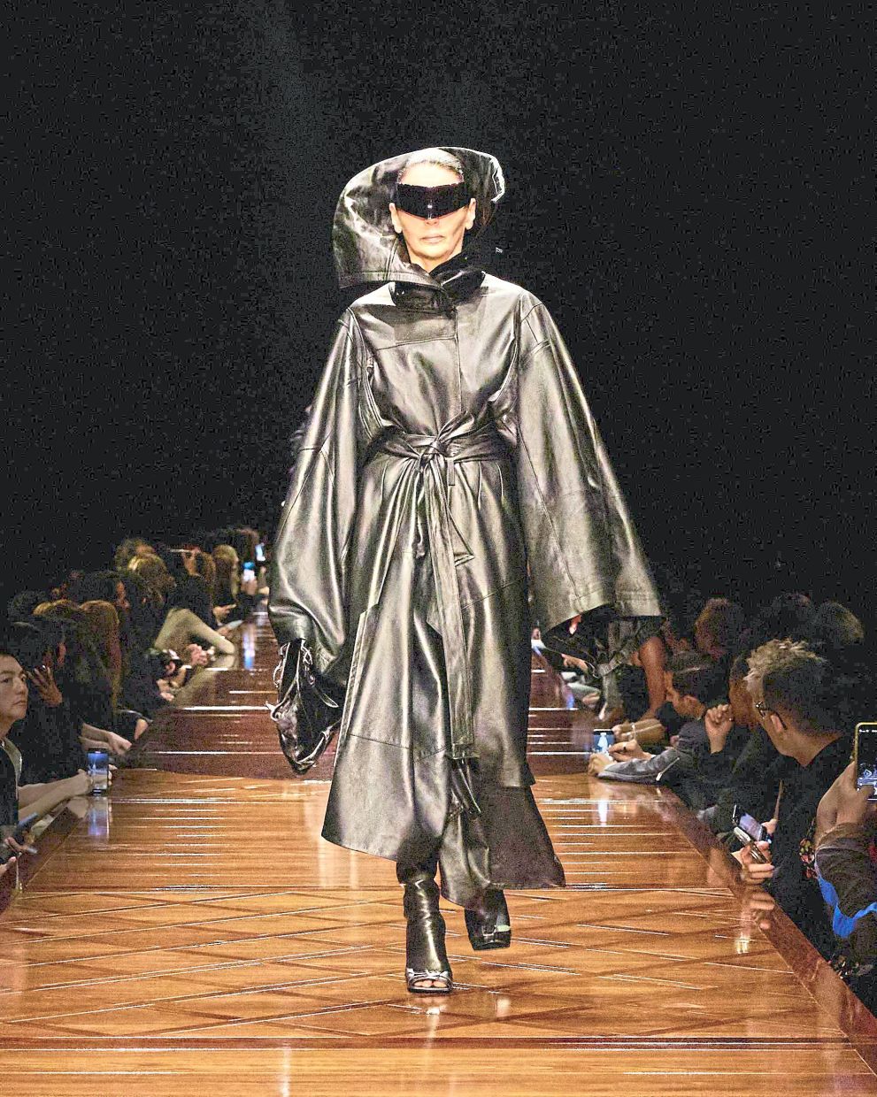 A leather coat featuring a sculptural and dramatic collar makes a striking statement. Photo: Balanciaga