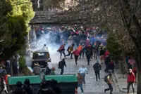 Bolivia police teargas Morales supporters protesting electoral ban