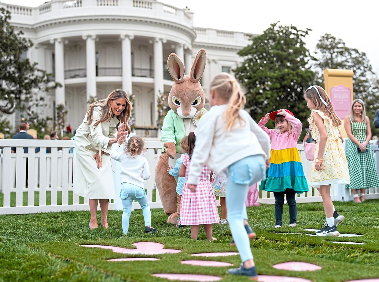 Melania greeting children during the 2025 White House Easter Egg Roll on the South Lawn of the White House.