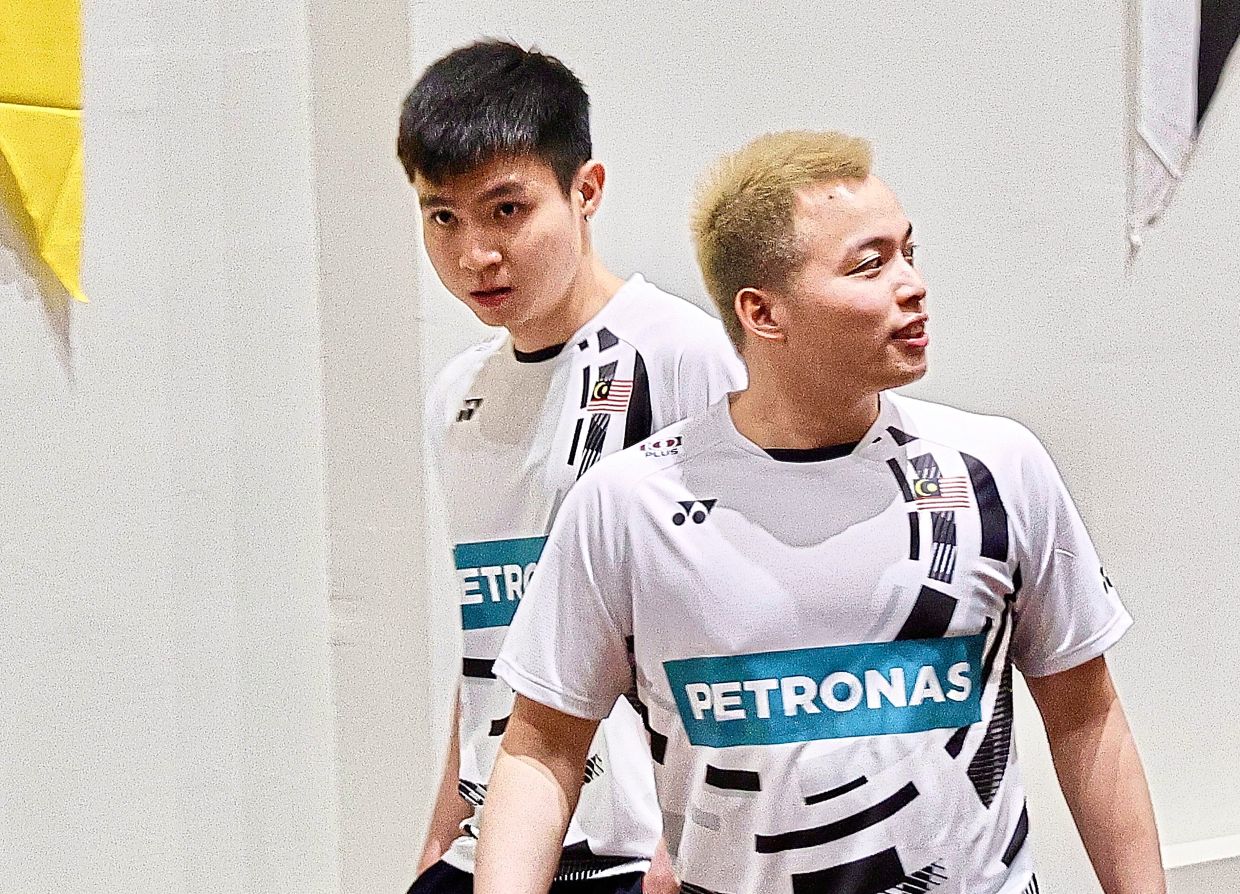 National men’s double player, Aaron Chia with Soh Wooi Yik during the official signing ceremony BAM 100Plus 2025-2028 at Badminton Association of Malaysia, Bukit Kiara. — FAIHAN GHANI/The Star