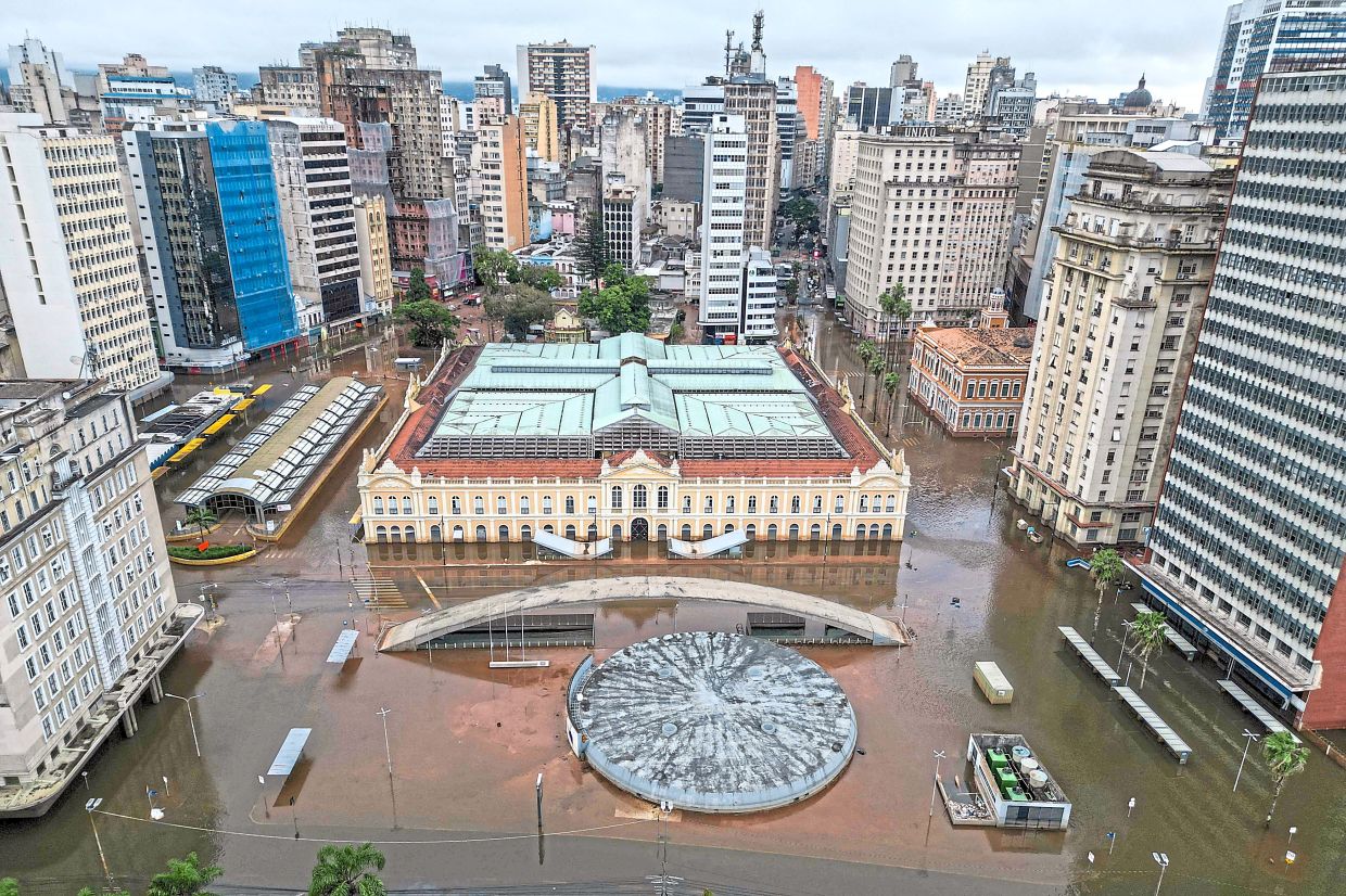 Aerial view of the flooded surroundings of the public market in downtown Porto Alegre, last year. — AFP