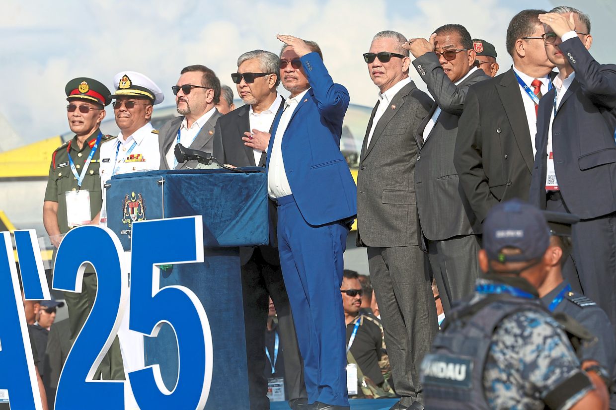 Pride of the nation: Anwar (in blue) with other ministers and dignitaries at the opening ceremony of Lima’25 at the Mahsuri International Exhibition Centre in Langkawi. — Bernama