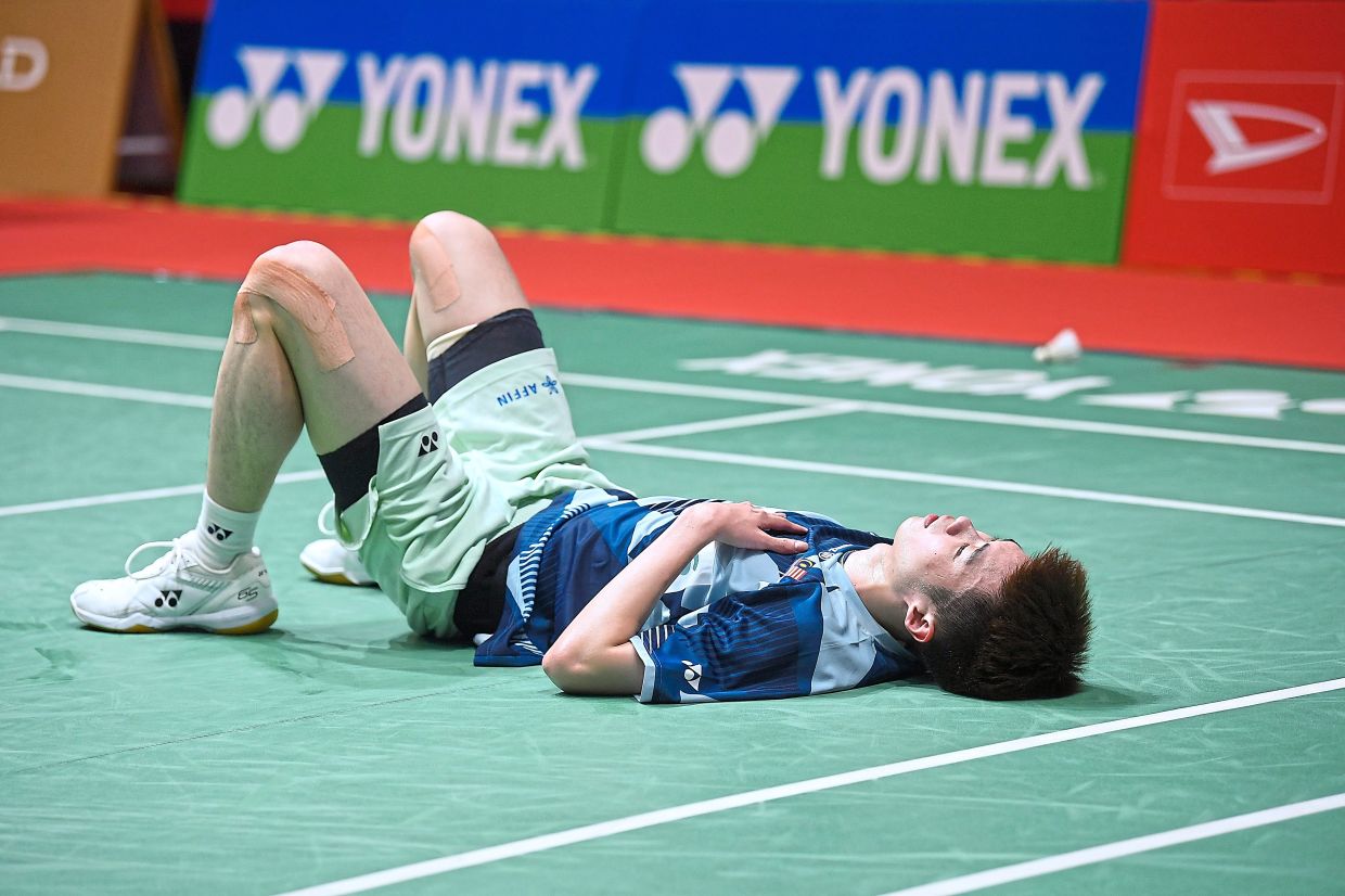 A dampener: Ng Tze Yong writhing in pain after injuring his right knee during the match against Hong Kong’s Angus Ng Ka Long. — IZZRAFIQ ALIAS/The Star