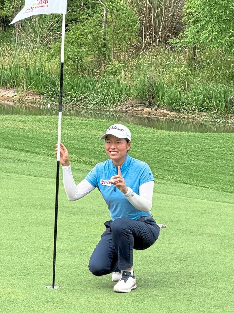 Feeling good: Winnie Ng is all smiles after scoring her first-hole-in-one in Chengdu.