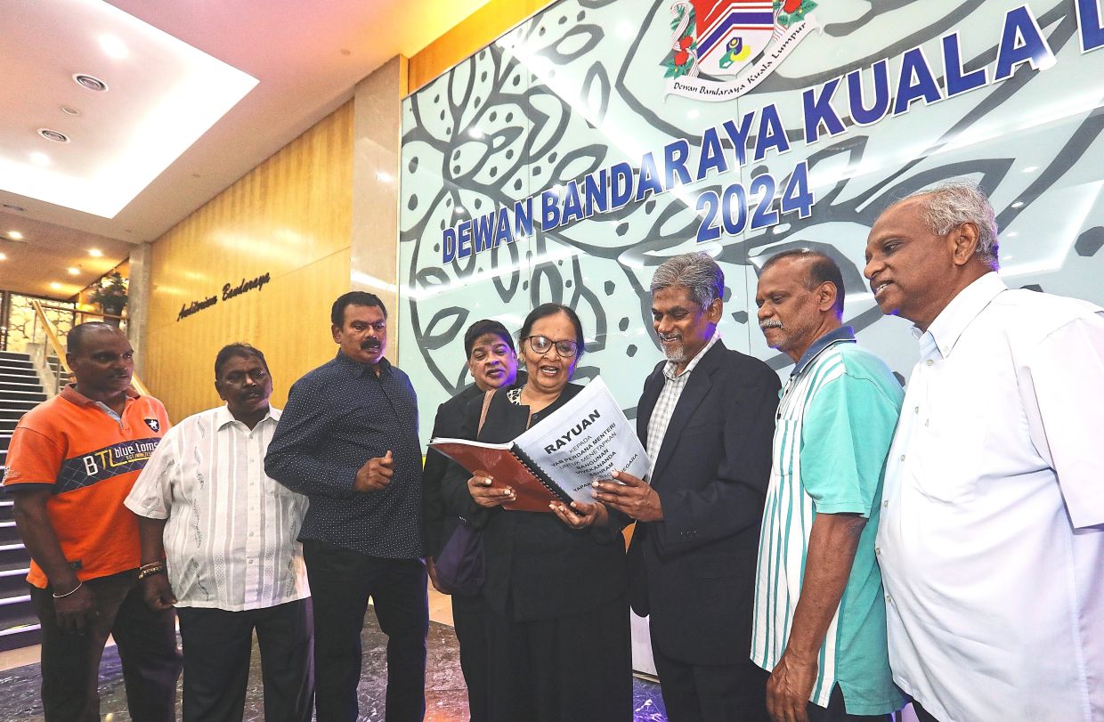Deva Kunjari (fourth from right) with Save Vivekanada Ashram members presenting objections on the rezoning of the ashram land last year. - Filepic