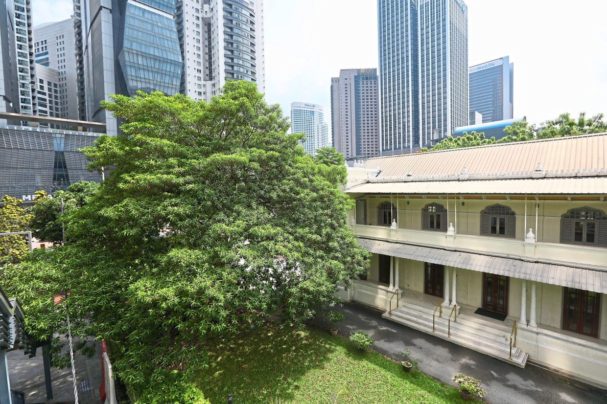A quiet corner of the Vivekananda Ashram complex with its colonial-style veranda shaded by mature trees. — Filepic