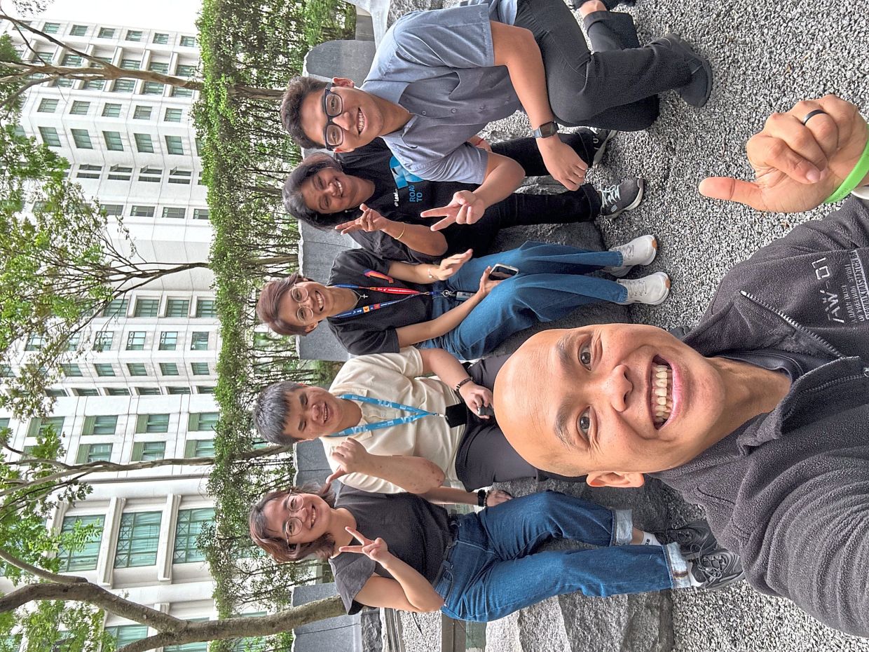 Yeoh (seated, second from left) with the YTL Foundation team. Photo: KENZON YEOH