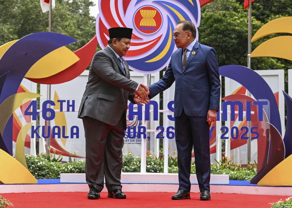 Malaysia's Prime Minister Anwar Ibrahim, right, greets Indonesia's President Prabowo Subianto before the plenary session at the Association of South-East Asian Nations (Asean) Summit in Kuala Lumpur Monday, May 26, 2025.-- Mohd Rasfan/Pool Photo via AP