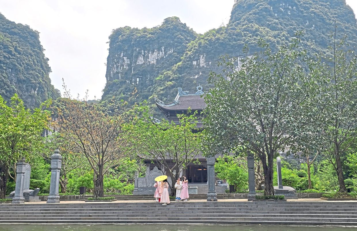 Visitors at the Suoi Tien temple are welcome to pray inside, or take tons of pictures outside.