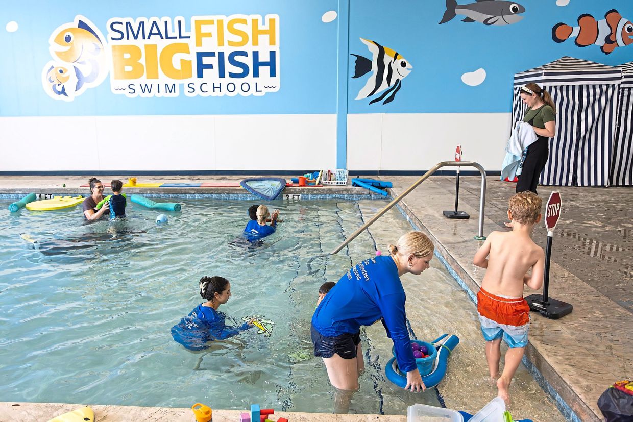 Swim instructors work with students during a swim class. Photo: BEN RUSNAK/Children’s Services Council of Palm Beach County/AP
