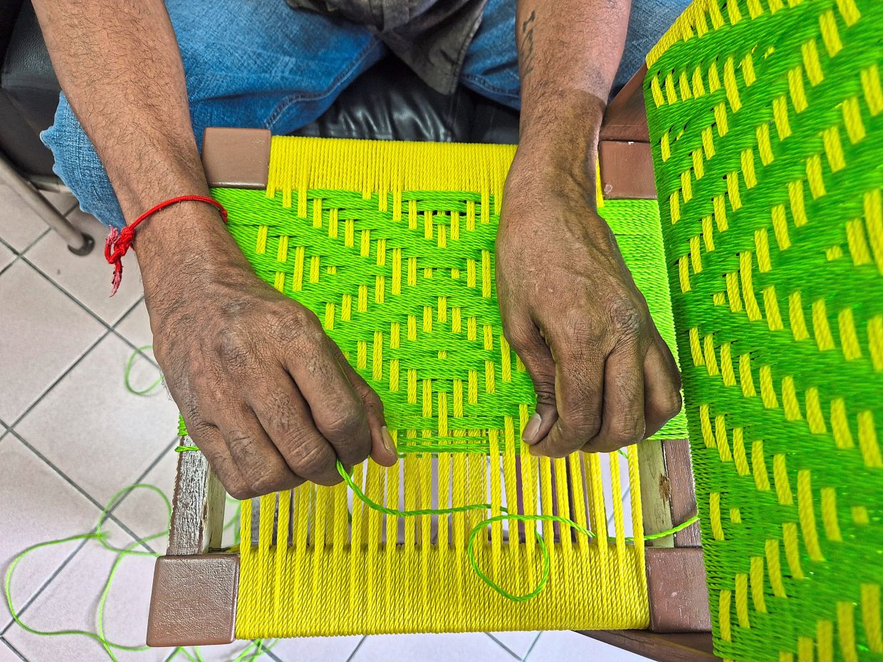 Each handcrafted stool takes Saravanan two days to complete, using different weaving techniques. Photo: The Star/Sheela Chandran 