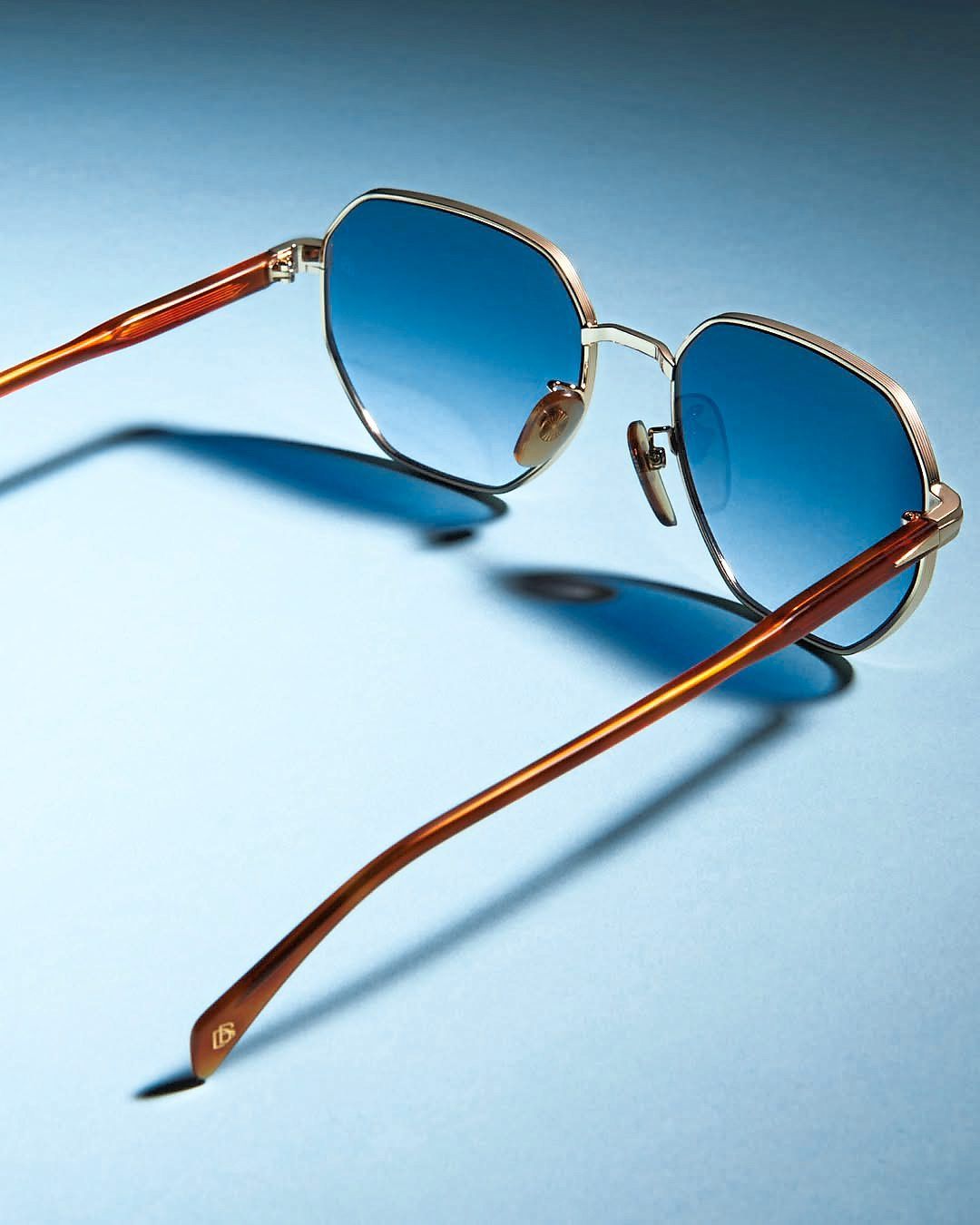 Coloured lenses can help make classic silhouettes look cooler, like this one from Eyewear By David Beckham. Photo: Safilo
