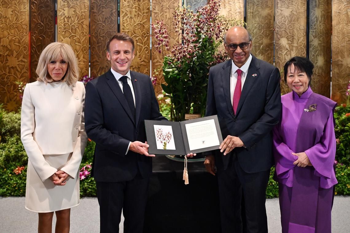 The orchid naming ceremony for French President Emmanuel Macron (second from left), pictured with President Tharman Shanmugaratnam and their wives, Brigitte Macron and Jane Ittogi, was held at Parliament House on May 30. -- ST PHOTO: KUA CHEE SIONG