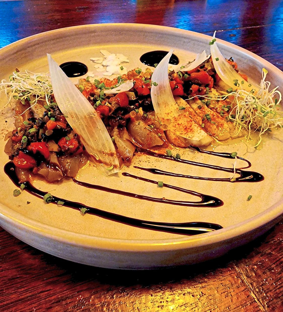 The Mediterranean salad is a triumphant offering that features eggplant, peppers, olives and capers.
