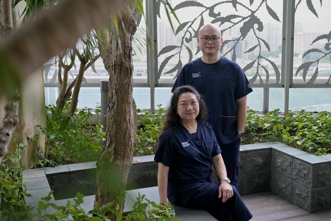 Professor Caroline Chee and Dr Yuen Yew Sen from the department of ophthalmology at National University Hospital who took part in the trial. -- ST PHOTO: DESMOND FOO