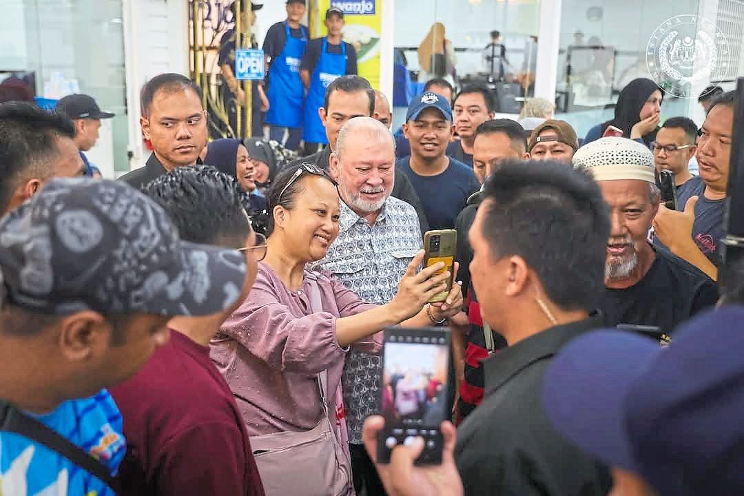 His Majesty graciously accommodating photo requests from patrons during a visit to Nasi Lemak Wanjo Kampung Baru on his official birthday last year. — All photos courtesy of Sultan Ibrahim’s official Facebook page
