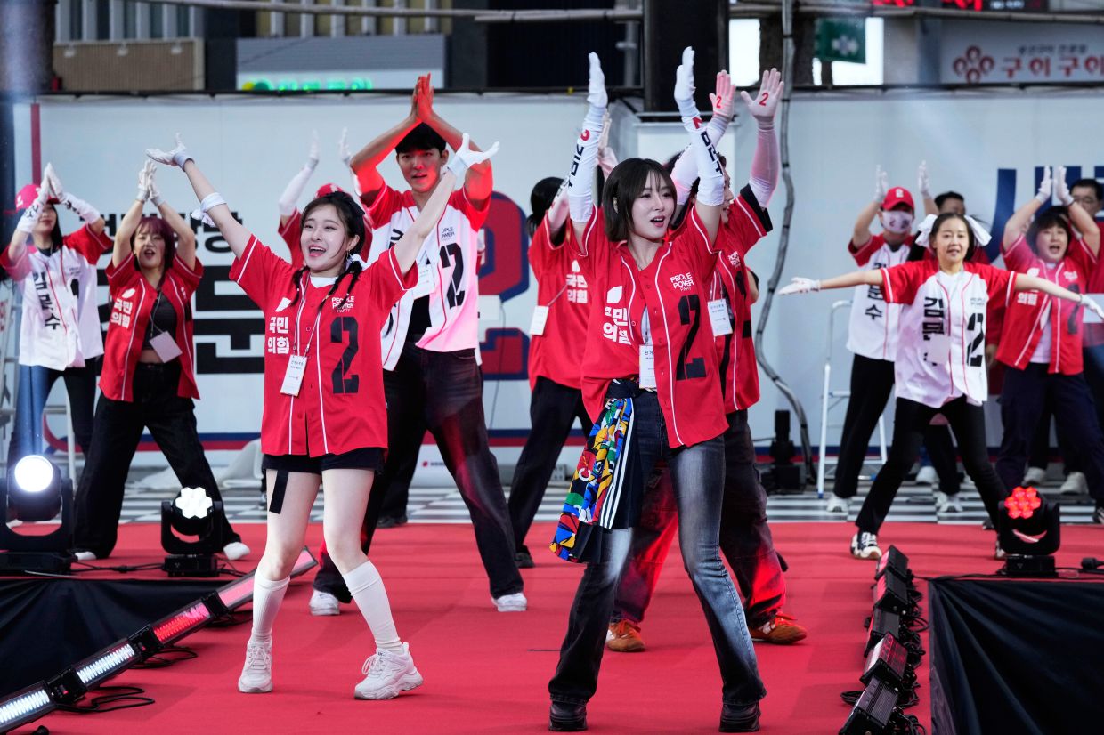 Supporters of Kim Moon Soo, presidential candidate with the People Power Party, perform during his election campaign rally in Seoul, South Korea, late Monday, June 2, 2025. -- AP Photo/Ahn Young-joon