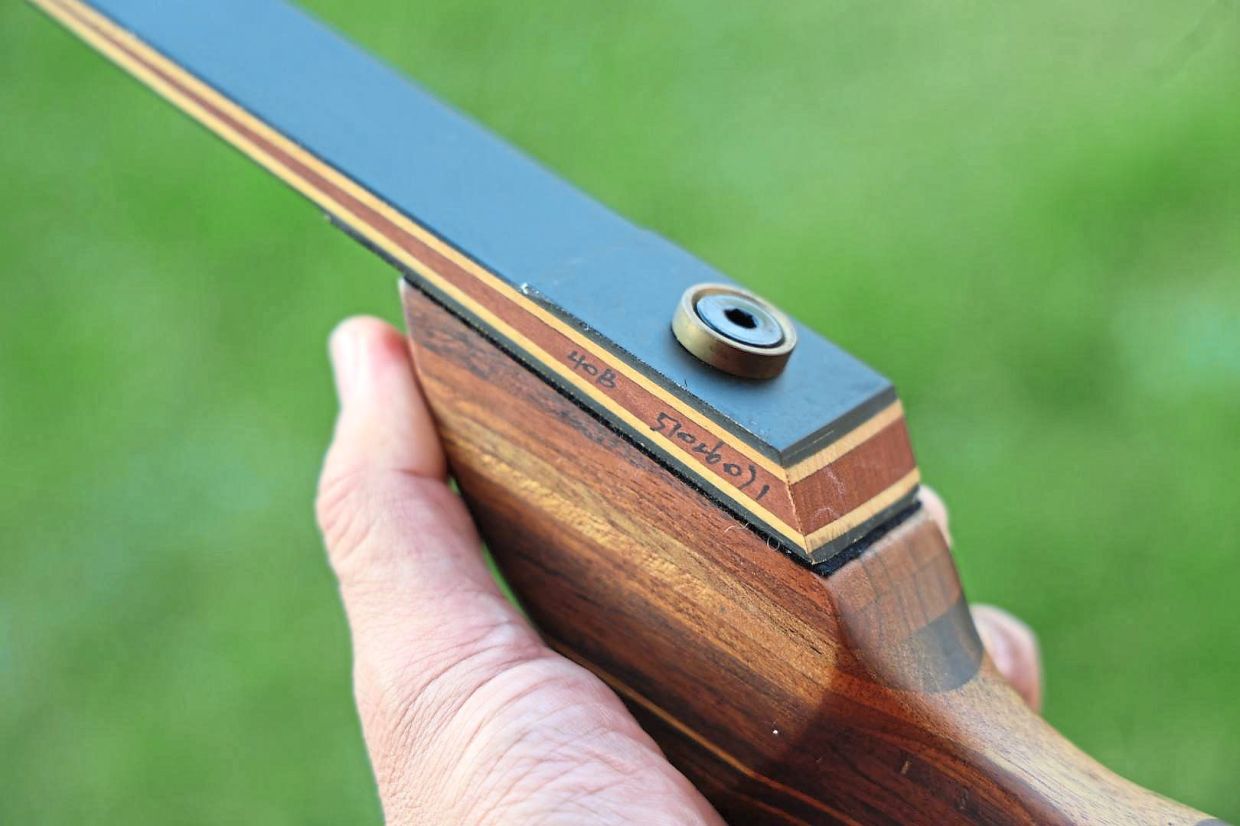 The riser and limbs are bolted together on this bow.