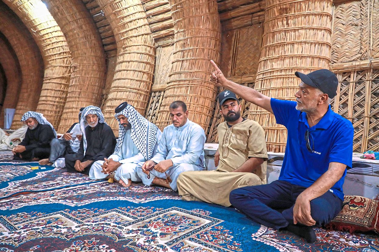 Environmental activists meeting with the indigenous people of Huwaizah. — AFP 