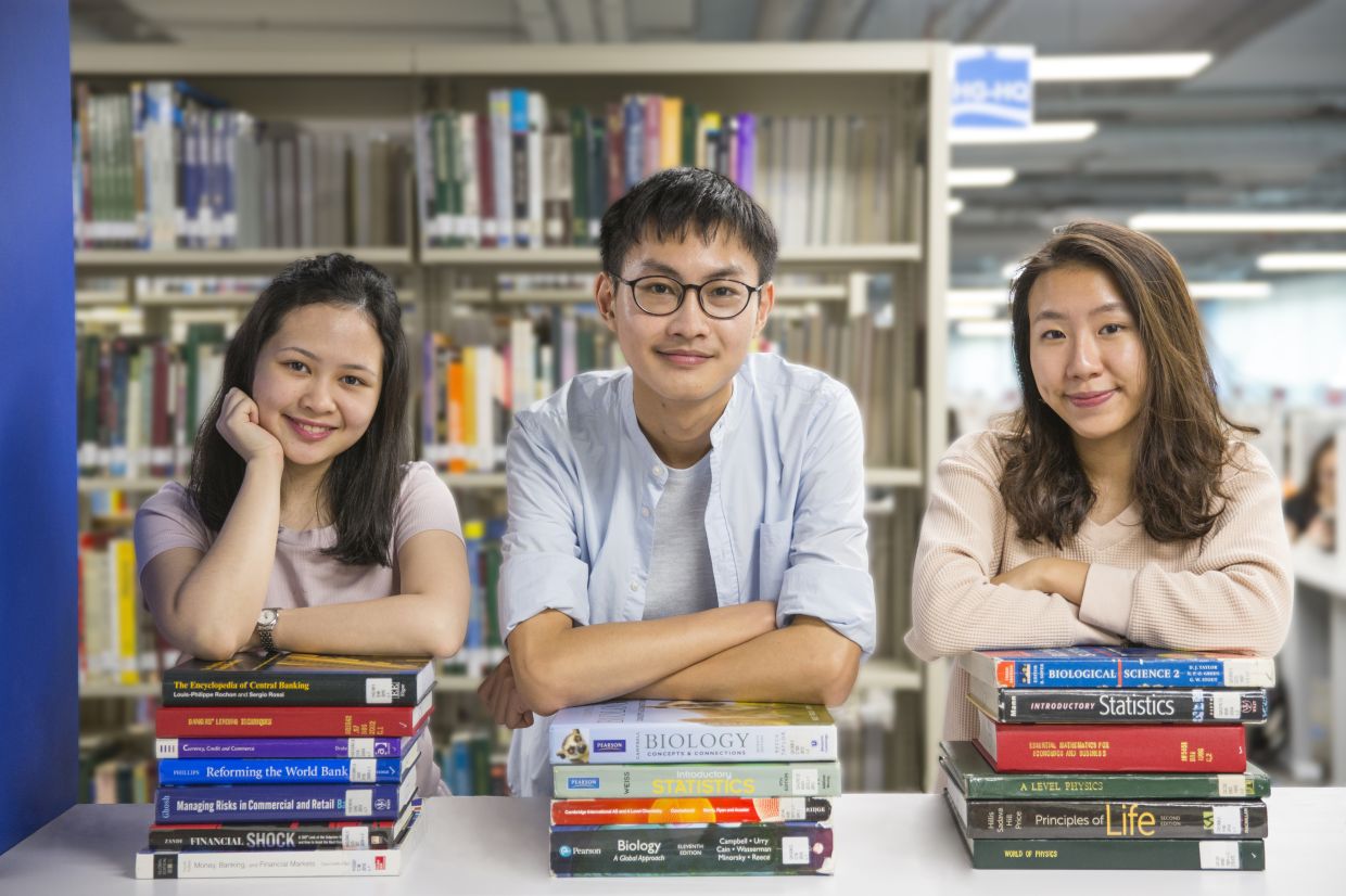 Sunway University students embracing academic excellence with confidence and determination at the campus library.