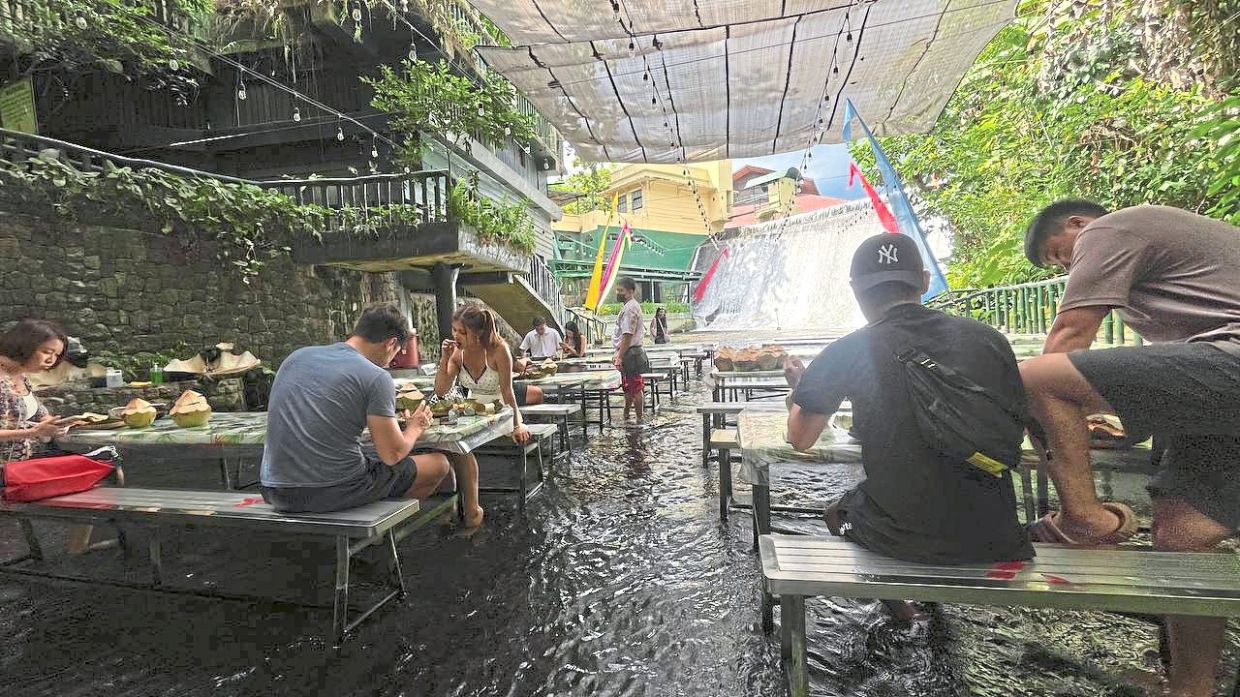At Villa Escudero, enjoy lunch with your feet submerged in water near a waterfall. — M. IRSYAD/The Star