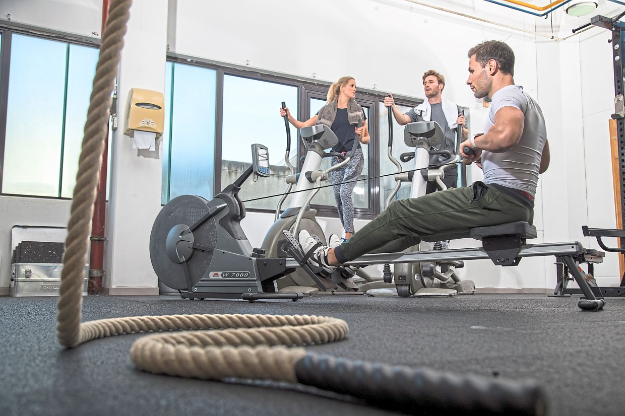 Regular training on a stationary rowing machine will make performing pull-ups easier.