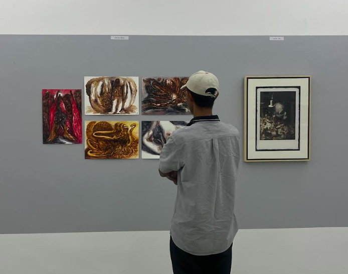 A visitor takes a closer look at Haslin Ismail’s works at Sedar Space’s group exhibition 'On Paper'. Photo: The Star/M. Irsyad 