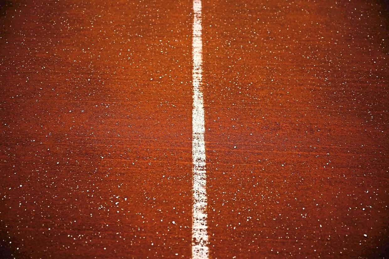 Calcium chloride captures and retains water on the courts.